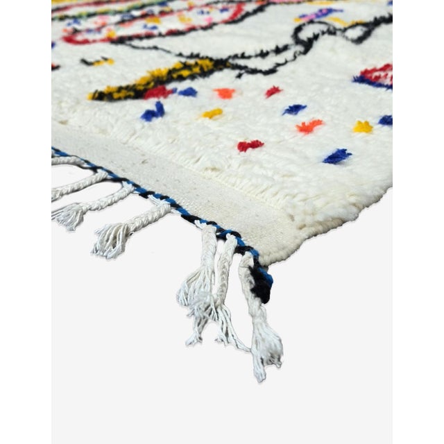 Handwoven Azilal Rug – Colorful Moroccan Berber Wool Rug This handwoven Azilal rug is a vibrant blend of traditional...