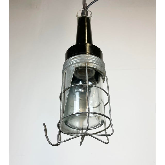 Industrial walkabout work lamp made in former Czechoslovakia during the 1960s These lamps were used in factories,...