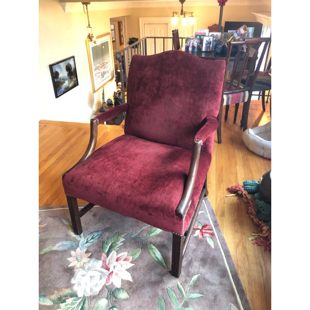 19th century roomy comfortable large Martha Washington style club chair having solid mahogany construction and plush...