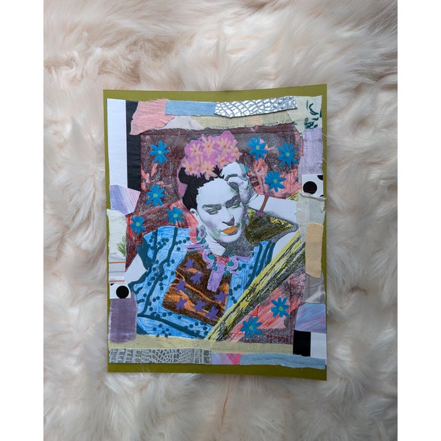 8.5" x 11" A mixed-media collage featuring the artist Frida Kahlo adorned in a maximalist style with colorful floral...