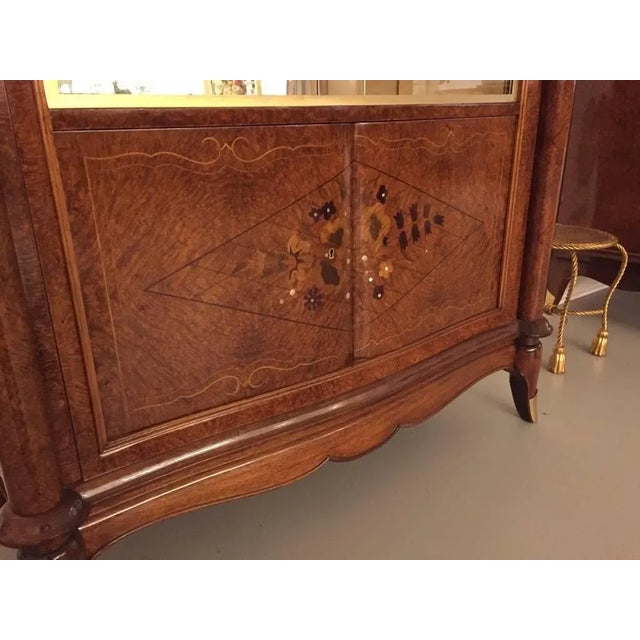 Rare stunning French Art Deco burl Amboyna vitrine or dry bar. Beautiful mother-of-pearl inlay with gorgeous marquetry....