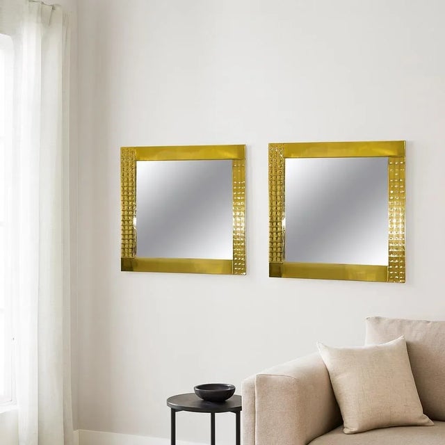This rare pair of vintage Italian brass wall mirrors from the 1970s embodies bold modernist design and exceptional...