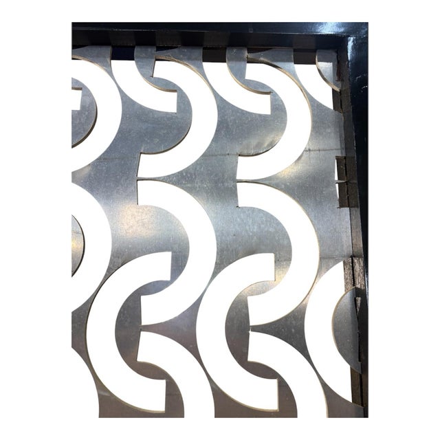 This Handmade Aluminum and Wood Divider Screen is a modern piece of furniture that adds a touch of elegance to any room....