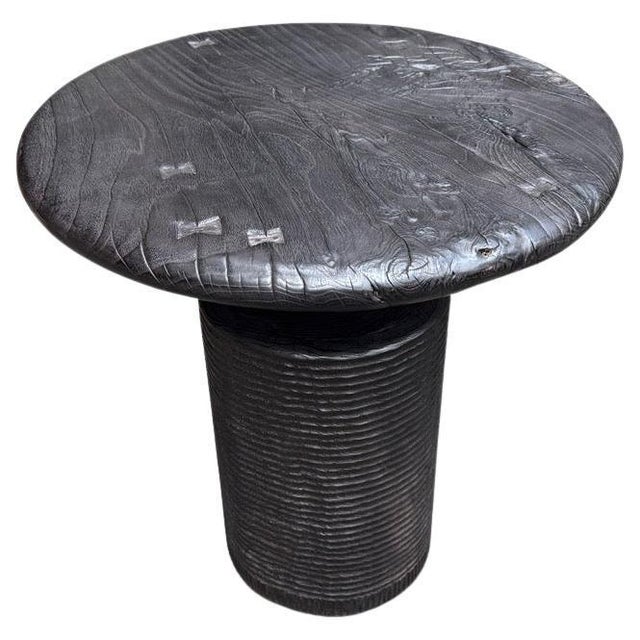 A century old mortar originally used to grind rice is repurposed into this unique side table or entrance table featuring...