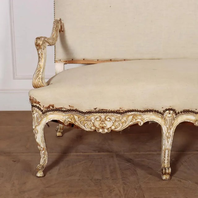 Late 19th C French canape sofa with serpentine seat. 1890. Seat height is 20 inches. Seat depth is 25 inches. This piece...