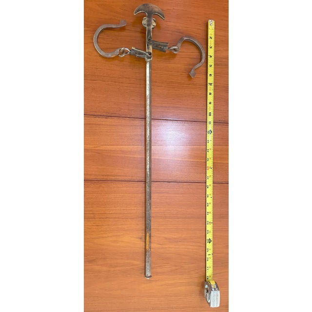 Antique Greek decorative butcher's steelyard iron weighing instruments. With two hooks, one's hook is up and one is down.