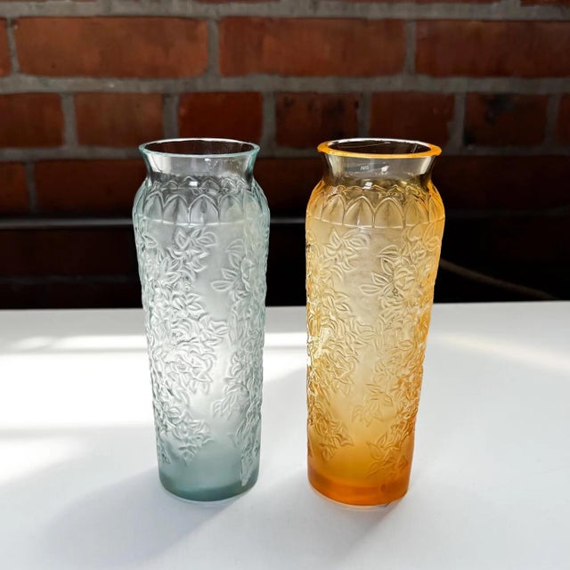 Authentic Lalique 'Bougainvillier' vases in frosted crystal Set of 2: One in mist blue, one in amber gold Intricate raised...