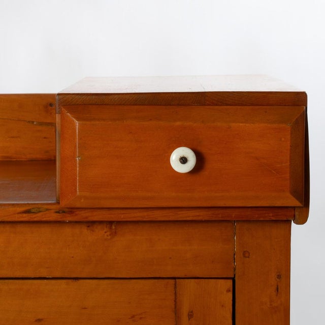 A 19th century country pine and poplar dry sink cupboard.