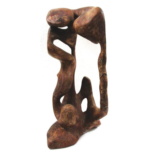 Mid-Century Modern Organic Biomorphic Figurative Burl Wood Carving Sculpture Measures 12" wide, 12" deep and 23" tall. The...