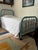 Charming Vintage teal metal bed frame. Classic iron rod design with a curved headboard and footboard. Great character and...