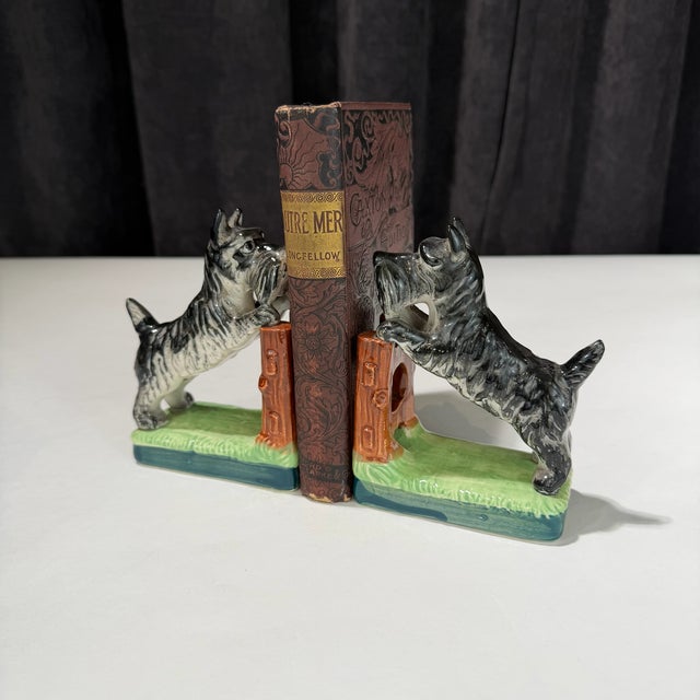 This charming pair of vintage ceramic dog bookends features a classic retro design with beautifully applied hand-painted...