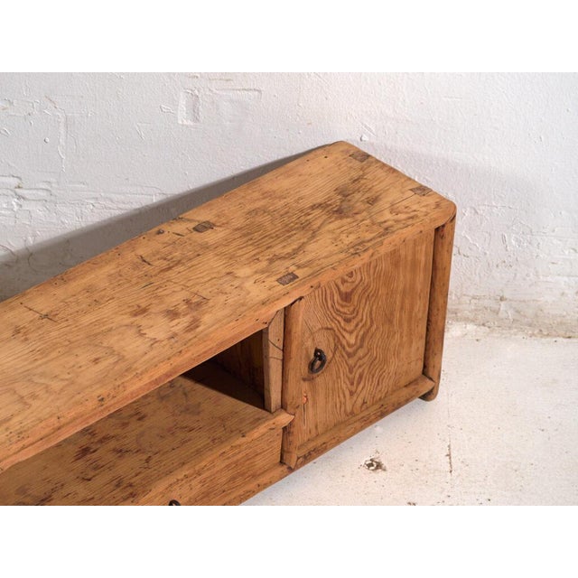 Antique low sideboard in pine wood, traditional Chinese furniture originating from Gansu and dated circa 1930. Originates...