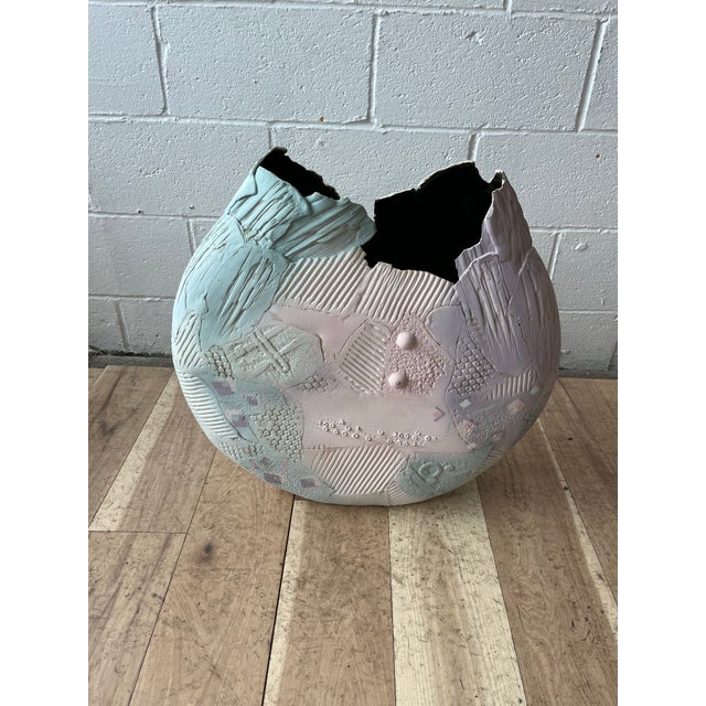 A sculptural hand-built ceramic vessel by American studio ceramic artist Gail Markiewicz. Constructed from individually...