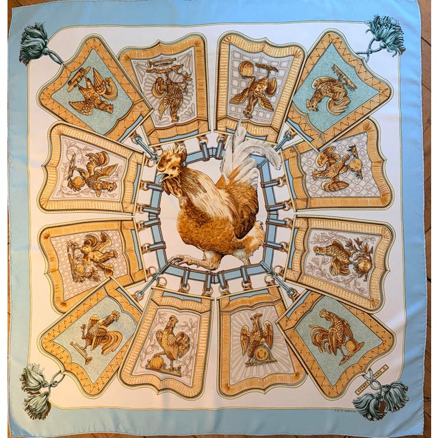 Hermès "Coqs d'Or" This striking scarf celebrates the rooster and its flamboyant plumage. Since the time of the French...