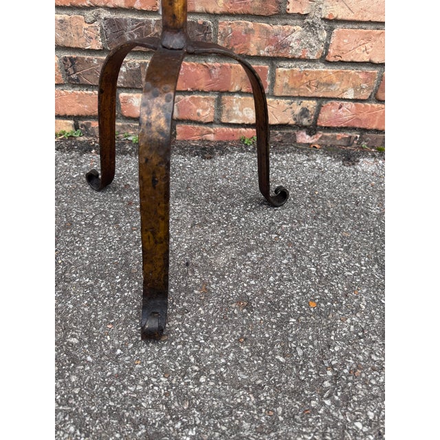 This is wonderful little Spanish made wrought iron drink table with an antiqued gold finish. It is contemporary yet...