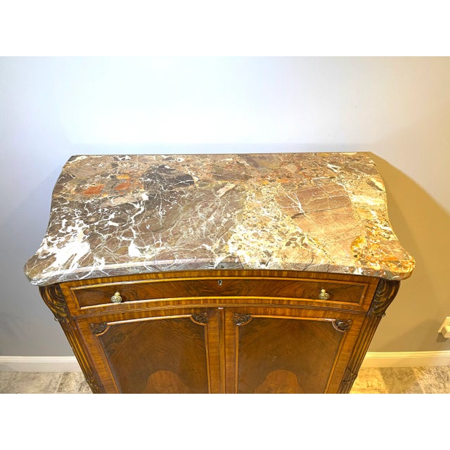 This antique French dresser from 1910 is a stunning piece of furniture made from satinwood and rosewood. The elegant Louie...