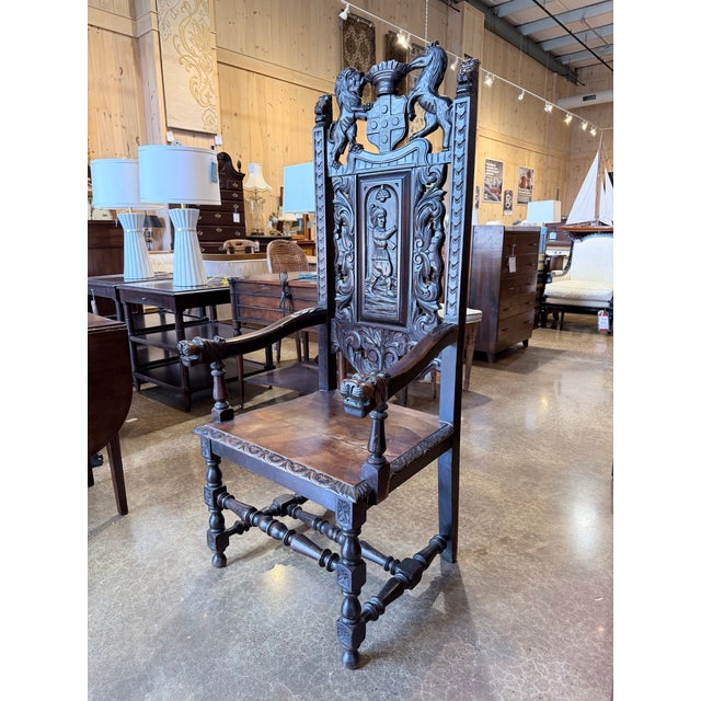 A commanding statement piece rooted in Renaissance Revival craftsmanship, this throne chair is masterfully carved in rich...