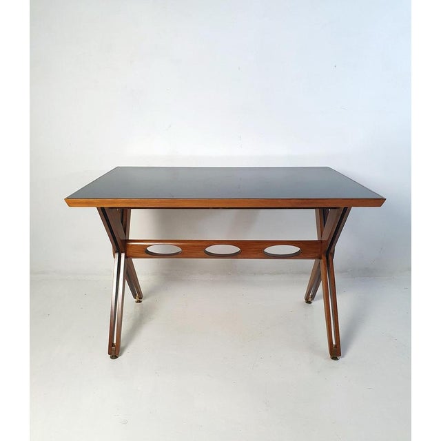 This writing desk, proudly crafted in Italy, embodies the timeless aesthetics of the Mid-Century design movement prevalent...