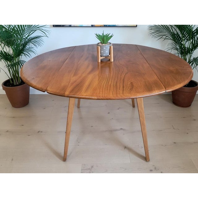 Vintage mid-century ercol blonde round / oval drop leaf plank dining table – solid elm & beech, 1960s - in superb...