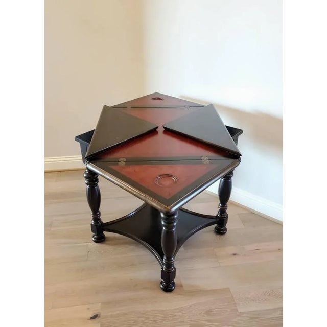 An extraordinary morphing envelope card table, hand-crafted and painted black, signed/stamped, high quality, "Seven Seas"...