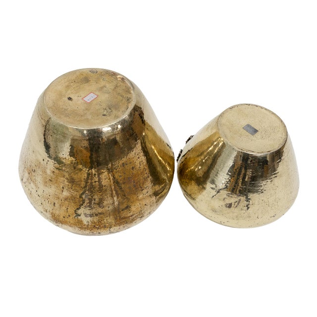 Two traditional handcrafted brass vessels, ideal for holding planters or decorative arrangements. Matching rope style...