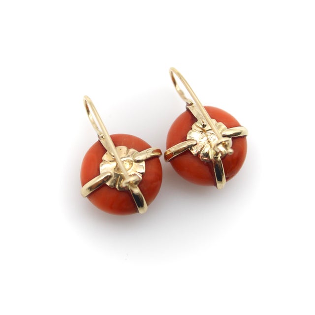 Circa the 1900’s, these pre-revolutionary Imperialist earrings center around gorgeous deep-orange coral oblong balls. The...