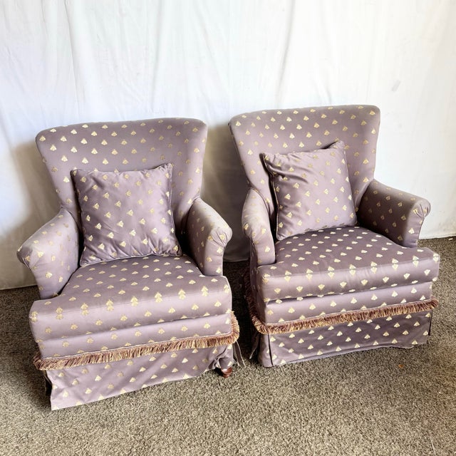 This enchanting pair of Regency-style lounge chairs brings refined whimsy to any interior. Wrapped in a luxurious...