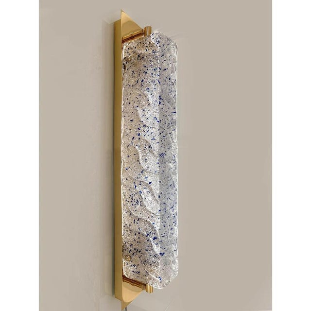 Contemporary rectangular wall sconces made in clear and blue “graniglia” murano glass - set of two the metal frame in a...
