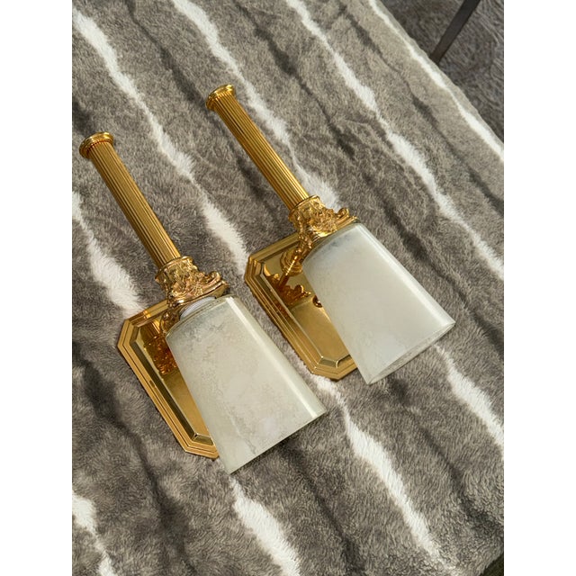 Vintage 1980s Solid Brass Neo-Classical style wall sconces. Weighty and solid with Corinthian column detail. Frosted glass...