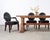 Substantial set of ten "Grand Soleil" black leather and mahogany dining chairs designed by John Hutton for Donghia. The...