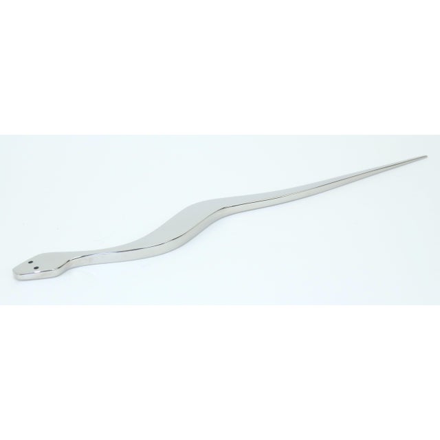 Meet the elusive paper snake...sleek, functional, fun to hold and even better to observe. This 2013 stainless steel snake...