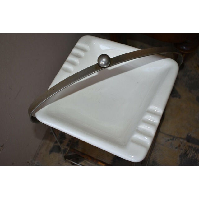 Cool Mid-Century White Glass Ashtray on Chrome Wrought Iron Base H: 23.5" overall W: 11" at base D: 11" at base W: 13...