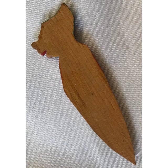 This cute little man in his night clothes is a hand-carved bookmark. There is a slit in the wood to slide over the page in...