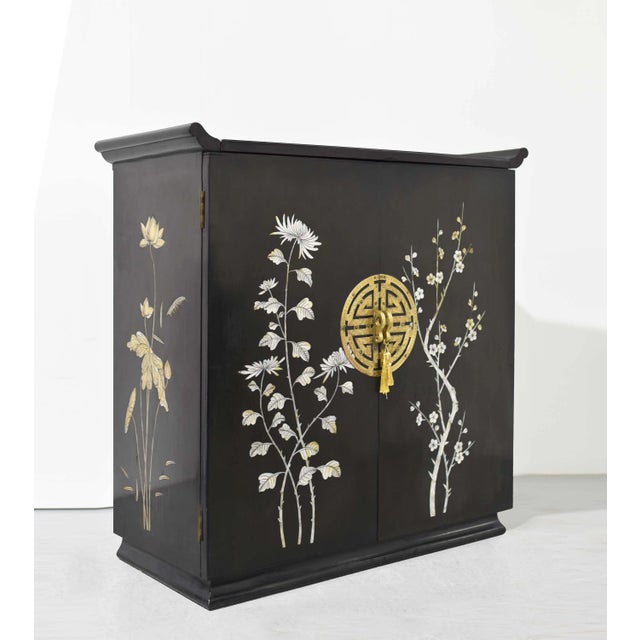 This show-stopping piece is a fantastic addition to any household - the Mid Century Chinoiserie Altar Mother of Pearl Flip...