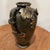 This vintage Japanese mixed-metal bronze vase features a high relief applied grapevine motif, adding a touch of elegance...