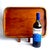 Offered is a vintage mid twentieth century teak wood tray with brass cuff accented corners. It features carve out stand up...