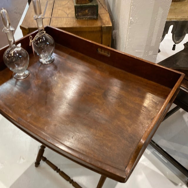 English Georgian tray stand. Woven straps on collapsible stand.