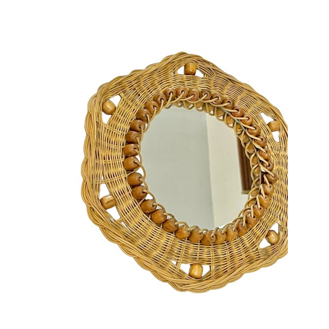 Bring effortless coastal charm and vintage character to your space with this French mid-century sunburst mirror. Handwoven...