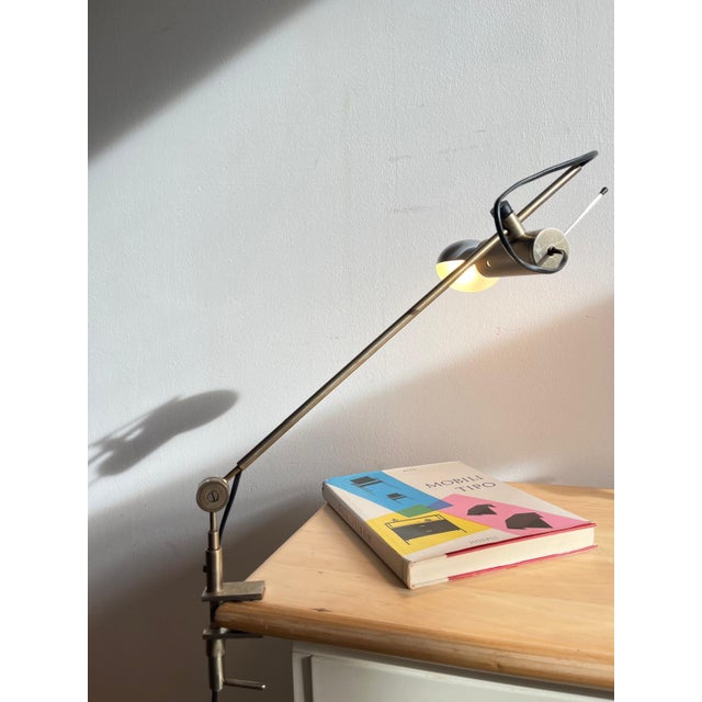Clamp table lamp, model 255 oluce, tito agnoli, 1959 the oluce model 255 clamp table lamp is a practical and elegant...