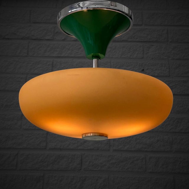 A refined Swedish modernist ceiling lamp from the 1930s, attributed to the manufacturer Arvid Böhlmarks Lampfabrik. The...