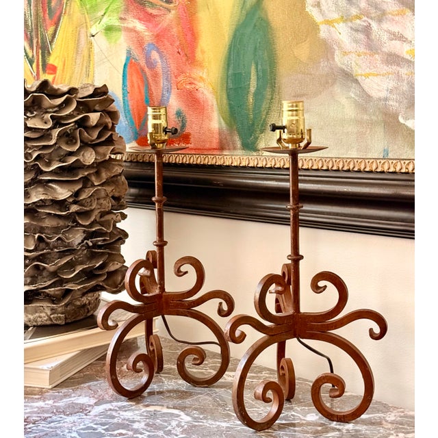 A Matching Pair of Vintage Rustic Wrought Iron Spanish Revival Style Candle Holders Converted to Table Lamps, Circa 1980s....