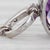 Gemstone Information: - Natural Amethyst - Carats - 1.40ct Cut - Cushion Color - Purple - Natural Diamonds - Total Carats...