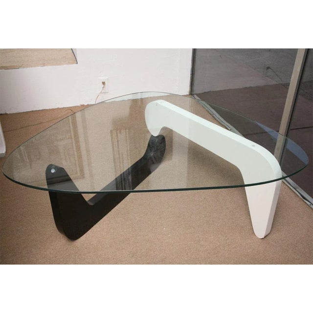 This graceful, organic Noguchi coffee table is lacquered in black and white. It would be a beautiful element in the home...