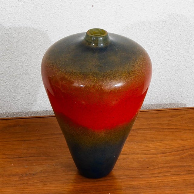 Unique hand blown glass vase Circa 1970. It comes in blue red and yellow color with unique clear glass designed throughout.