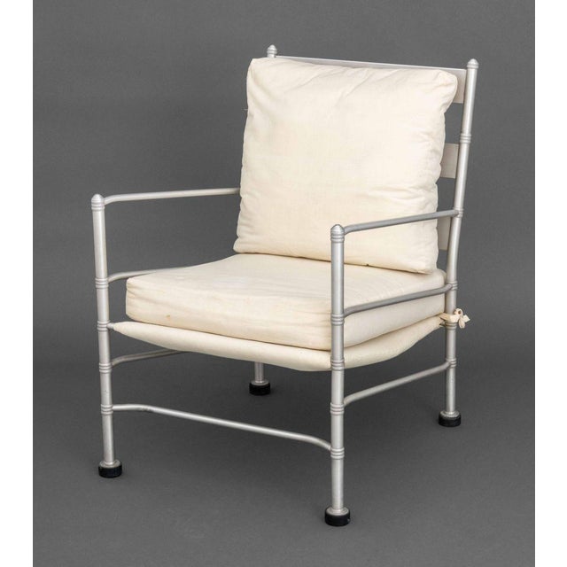 Warren McArthur (American, 1885-1961) Art Deco Easy Chair, aluminum, Bakelite, and fabric upholstery. 34" H x 23" W x 28"...