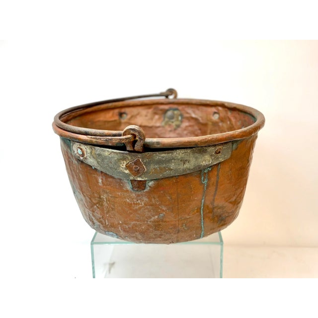 Mid 19th century French copper pot, used to make jams or jellies. Has an iron handle. One repair on near bottom, done many...
