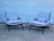 Pair of Field Lounge Chairs by Blu Dot, which feature sculpted steel and bent wood shell, plush foam padding, and a...