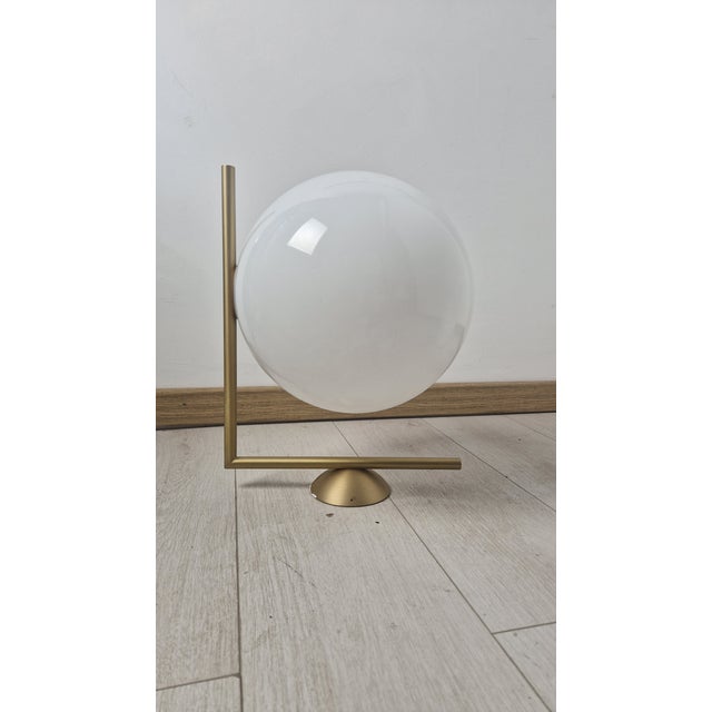 Vintage Wall Lamp in Brass with Glass Sphere by Michael Anastassiades for Flos, 2010s, in Very Good conditions. Designed...