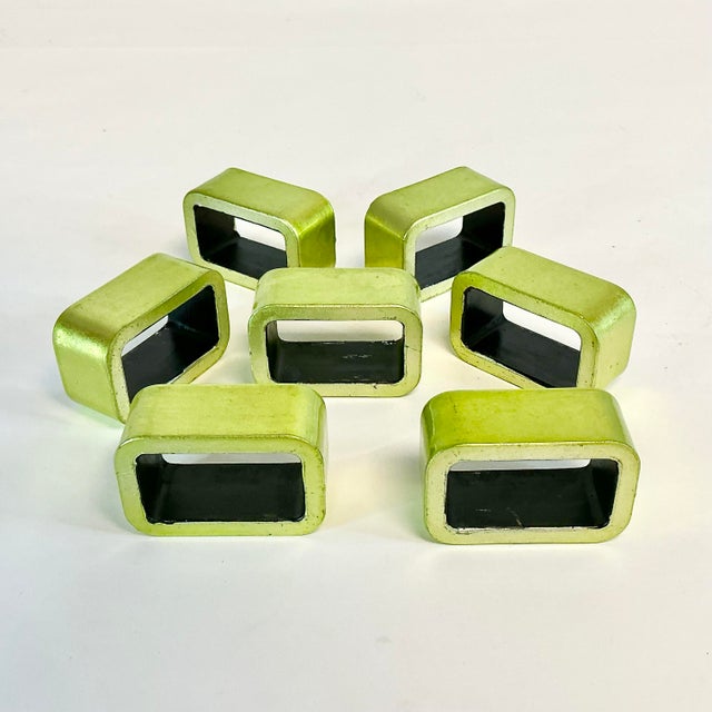 This set of seven 1980s Postmodern Napkin Rings. They are heavy for napkin rings and in a rectangular shape. The inside is...