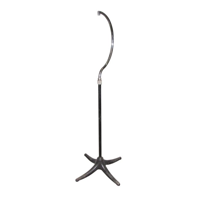 Reclaimed floor stand holder with a ball joint just below the curve. A sturdy X base ensures stability while the hook...